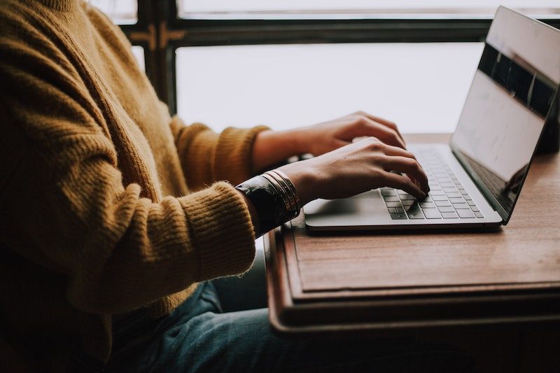 Person at computer - Photo by Christin Hume on Unsplash